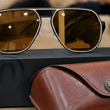 Polygon aviator sunglasses with brown lenses on a brown SUNGAIT sunglasses case