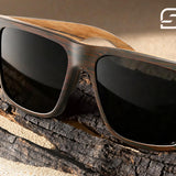SUNGAIT wood sunglasses with natural grain pattern on wooden surface
